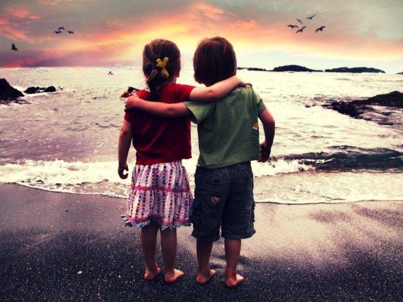 little boy and girl at the beach